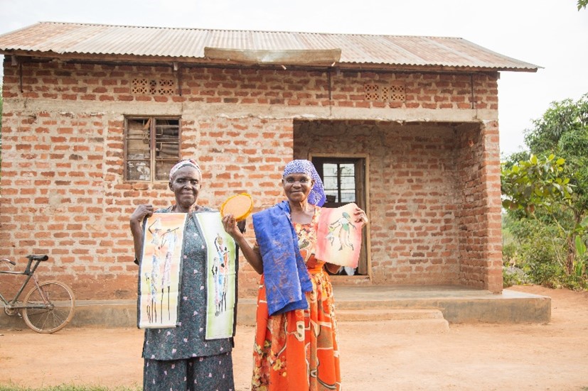 Anyango Aida and Masaba Florence with products made with beeswax. 