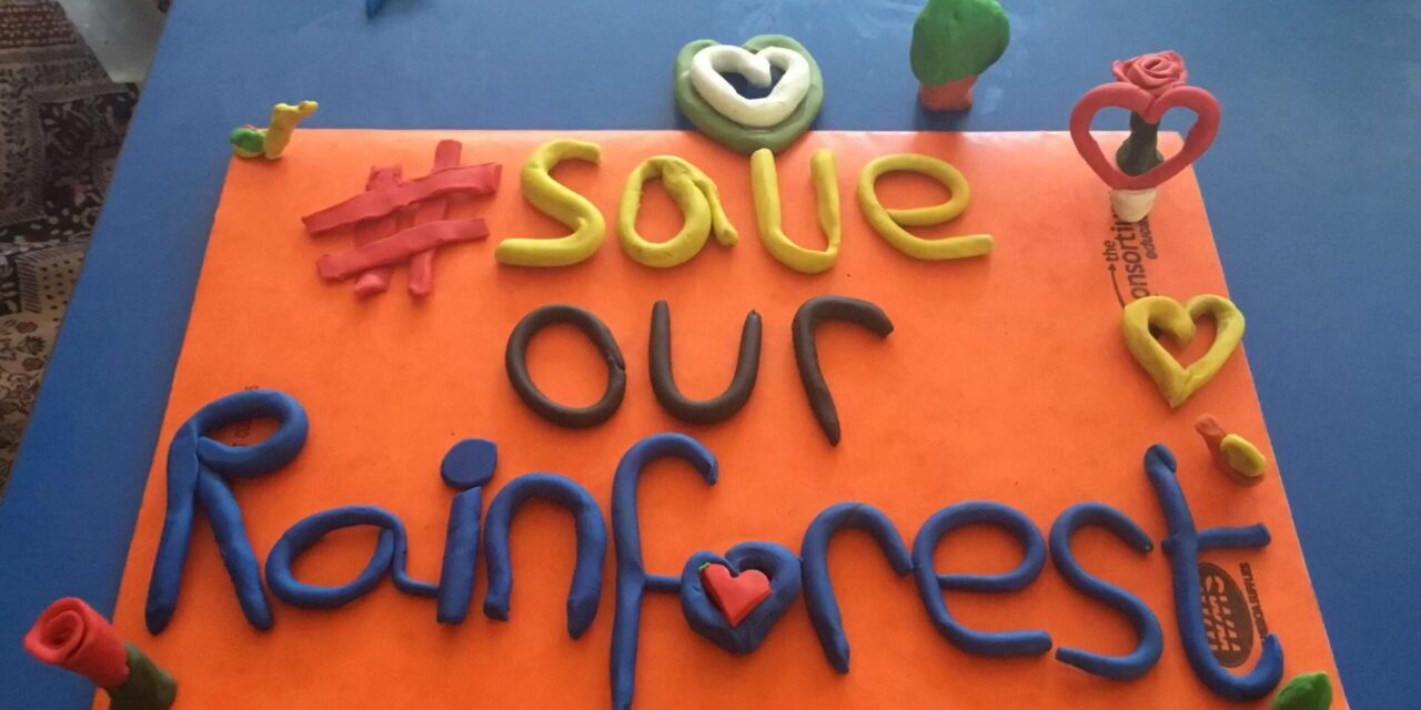#SaveOurRainforests written in clay as part of a stock motion animation